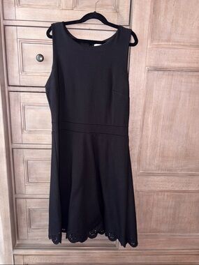 Classic Black Sleeveless A-Line Dress with eyelet bottom design, size 4